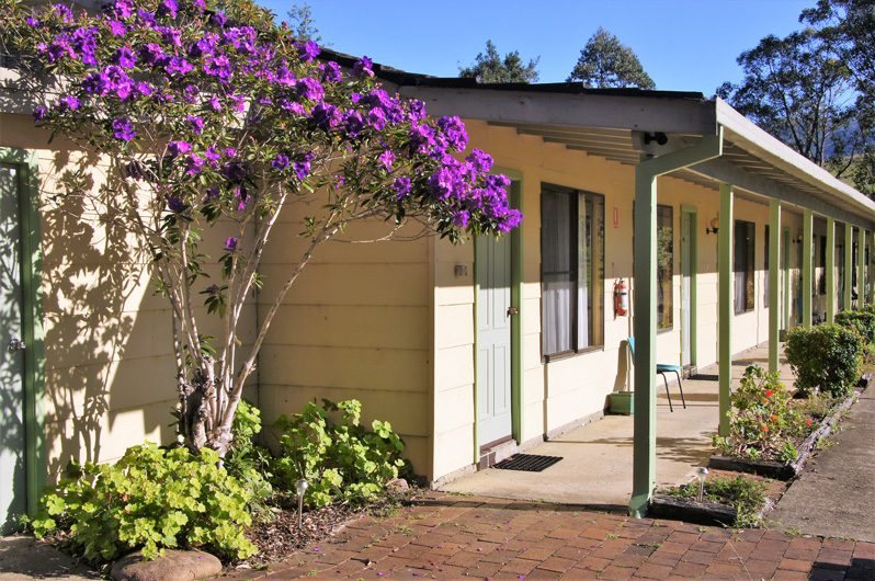 Lodge wing verandah with flowering tibouchina